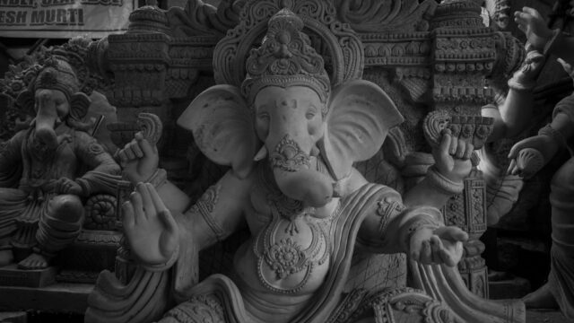 Monochrome photograph of a detailed Ganesha statue in Mumbai, India.